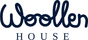 Logo of Woollen House with 'woollen' in cursive and 'HOUSE' in uppercase letters on a white background.