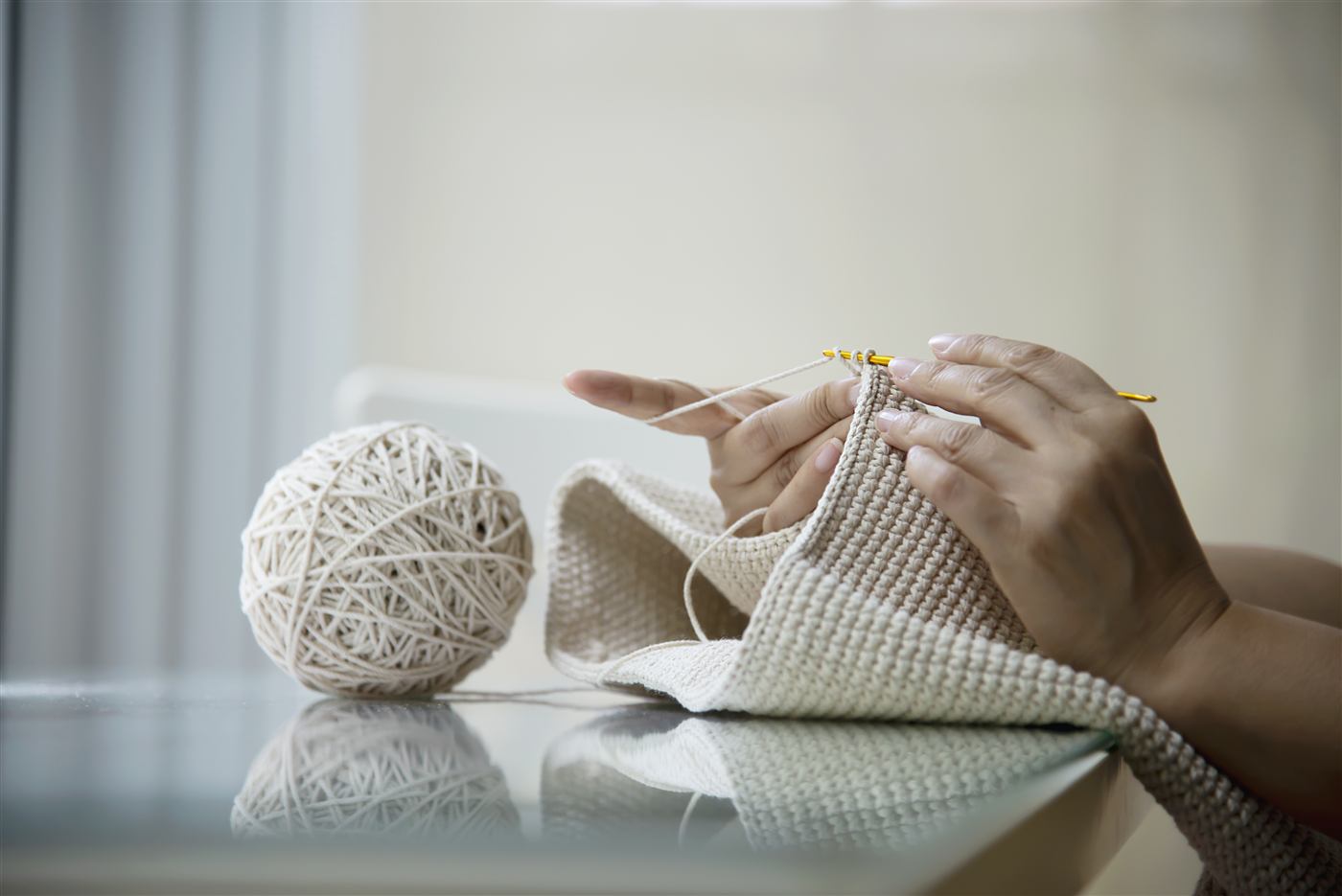 Creator knitting with yarn